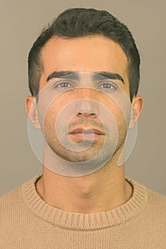 Face of young handsome Iranian man