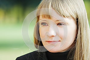 Face of young serene blond woman