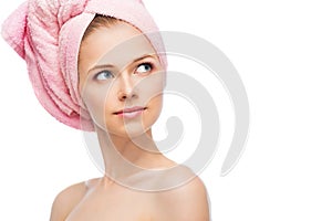 Face of young woman with a towel