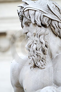 Face of Zeus in Piazza Navona fountain, Rome Italy