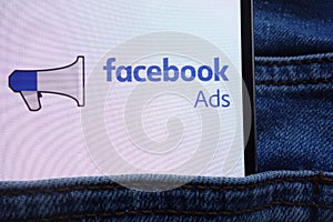 Facebook Ads logo displayed on smartphone hidden in jeans pocket