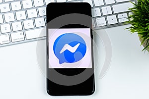 Facebook Messenger app logo on a smartphone screen.