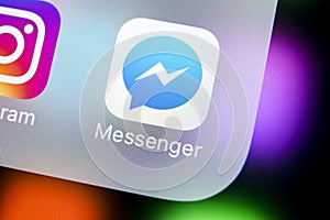 Facebook messenger application icon on Apple iPhone X screen close-up. Facebook messenger app icon. Online internet social media