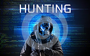 Faceless hacker on code background