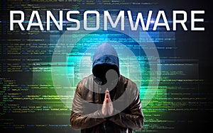 Faceless hacker on code background