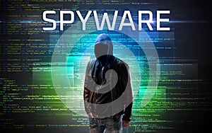 Faceless hacker on code background