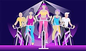 Faceless people on exercycles in spinning class photo