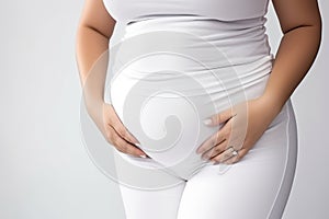 Faceless portrait of female fat belly. Body positivity or pregnancy concept