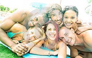 Faces of best friends taking selfie at swimming pool party - Hap