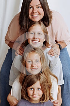 Faces of four girls in a row in casual clothes