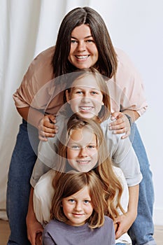 Faces of four girls in a row in casual clothes