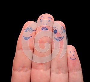 Faces painted on fingers