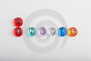 faceted colored stones on a white background