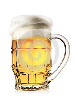 Faceted mug of light beer with foam