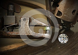 Faceting diamond, big gem with jewelery cutting equipment. Jewel photo