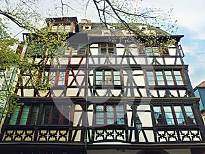 Fachwerk timber framed house in Colmar city, France, Alsace. Traditional architecture medieval home facade, historic town.