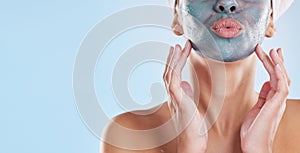 Facial, beauty and skincare with woman and face mask for clear skin, acne or luxury cosmetics against a blue background