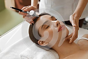 Facial Beauty Treatment. Woman Getting Oxygen Skin Peeling