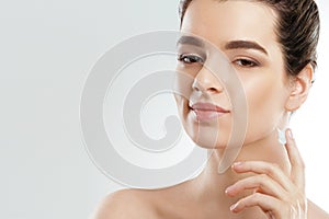 Facial Care. Female Applying Cream and Smiling. Portrait Of  Young Woman With Cosmetic Cream On Skin