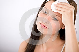 Facial care - woman removing make-up