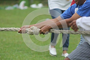 facial expression of a man who is participating in a tug of war competition