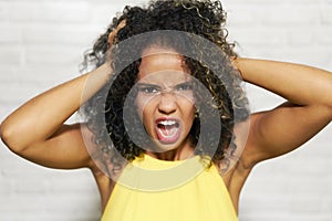 Facial Expressions Of Young Black Woman On Brick Wall