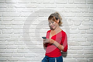 Facial Expressions Of Young Blonde Woman On Brick Wall