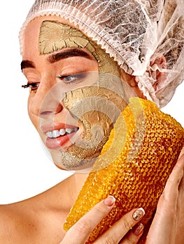 Facial honey clay face mask woman . Honeycombs homemade organic threatment. photo
