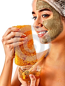 Facial honey clay face mask woman . Honeycombs homemade organic threatment. photo
