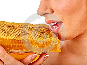 Facial honey mask for woman lips. Honeycombs homemade organic threatment. photo