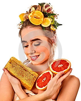 Facial honey mask for woman lips. Honeycombs natural homemade threatment. photo