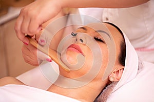 Facial madero massage with wooden tools photo