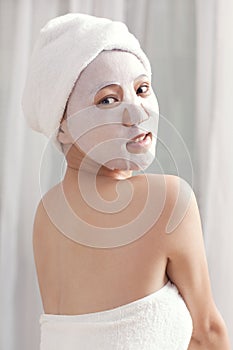 Facial mask for the young lady at spa