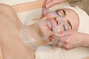 Facial massage with massagin oil