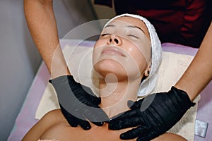 Facial massage. Spa skin and body care. Taking care of the beauty of the face. Cosmetology
