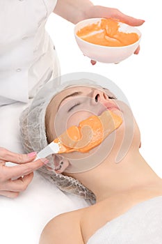 Facial orange alginate mask applying