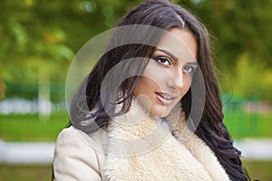 Facial portrait of a beautiful arab woman warmly clothed outdoor