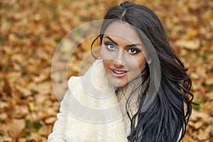 Facial portrait of a beautiful arab woman warmly clothed outdoor