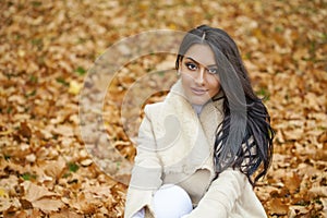 Facial portrait of a beautiful arab woman warmly clothed outdoor