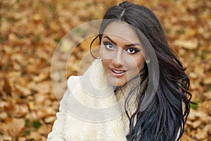 Facial portrait of a beautiful arab woman warmly clothed outdoor photo