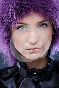 Facial portrait of beauty in purple wig