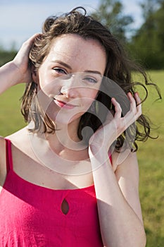 Facial portrait of a brunette in park