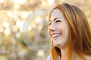 Facial portrait of a funny woman face laughing