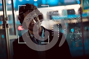 Facial recognition system, concept. Young man on the street, face recognition photo