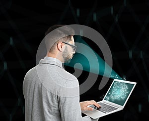 Facial recognition system. Man using laptop on background