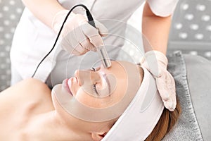 Facial skin care. Woman in a beauty salon.