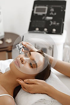 Facial Skincare. Woman Receiving Oxygen Peeling Beauty Treatment