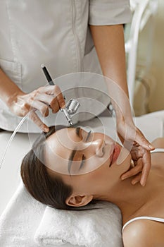 Facial Skincare. Woman Receiving Oxygen Peeling Beauty Treatment