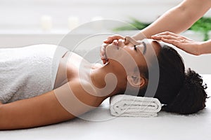 Facial spa massage for young african lady