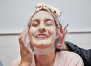 Facial, spa and skincare by a woman with a face mask for beauty treatment as self care by beautician. Wellness, peeling